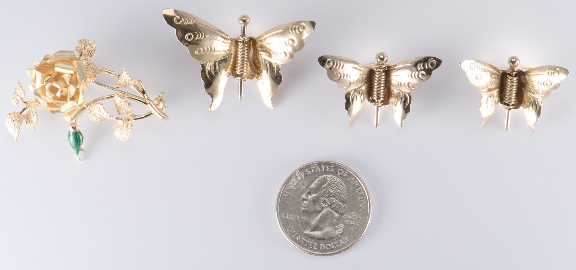 Lot 715: 4 Gold Pins incl Butterflies