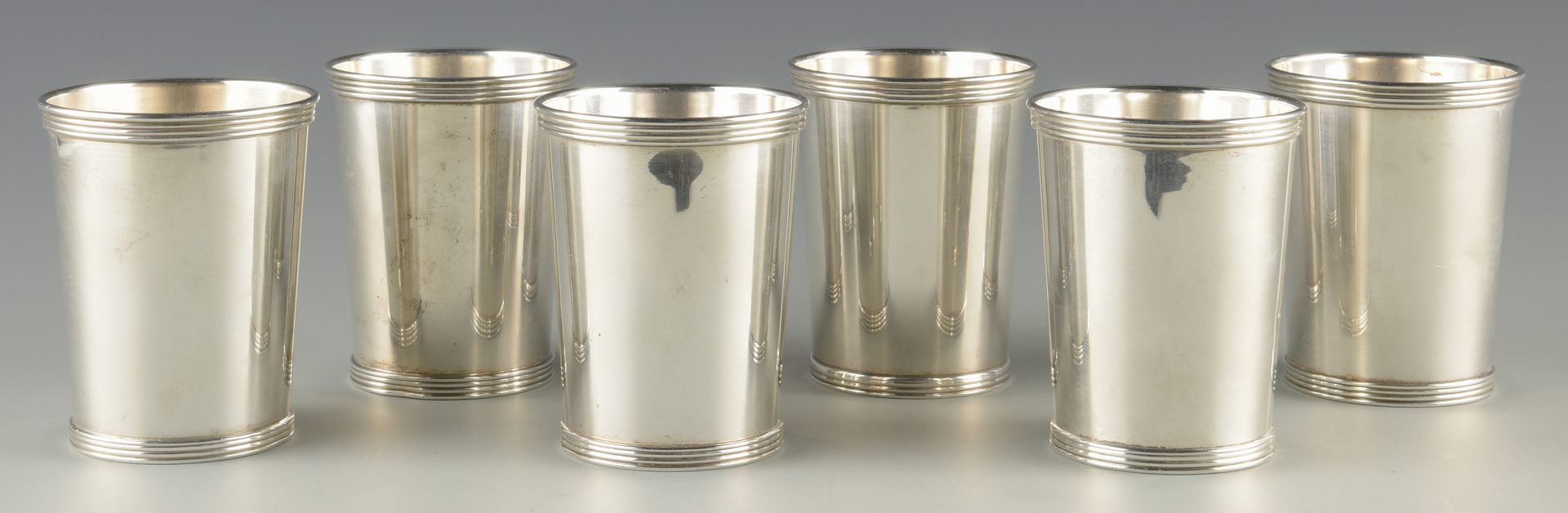 Lot 742: 6 Sterling Julep Cups, incl. Cartier