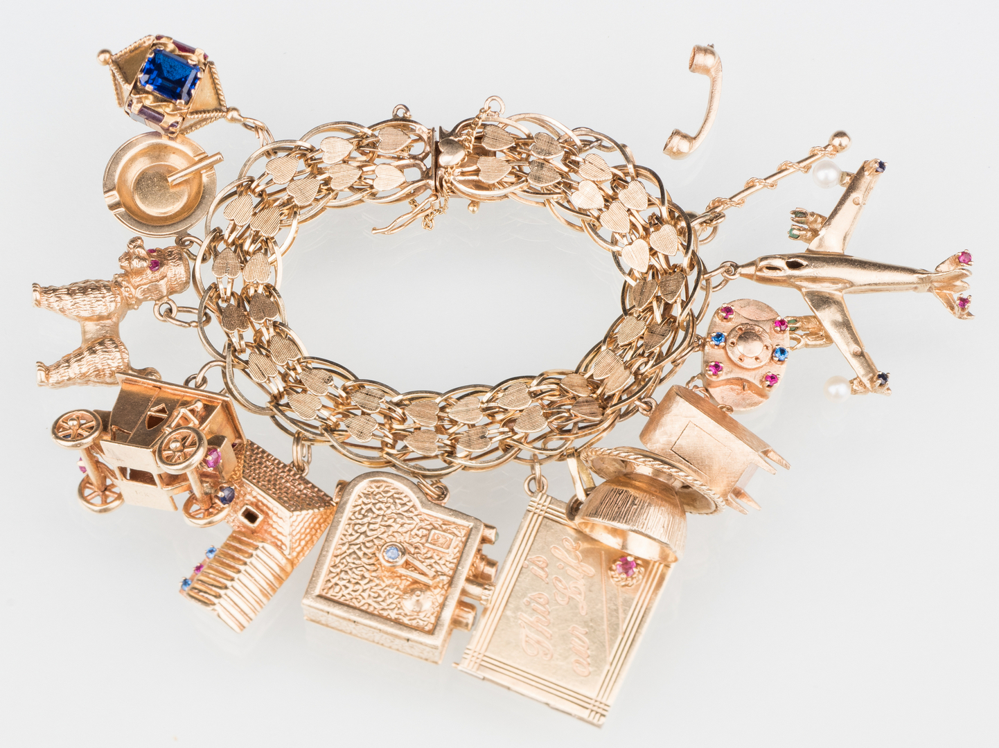 Lot 49: 14K Vintage Charm Bracelet, 126 grams | Case Auctions