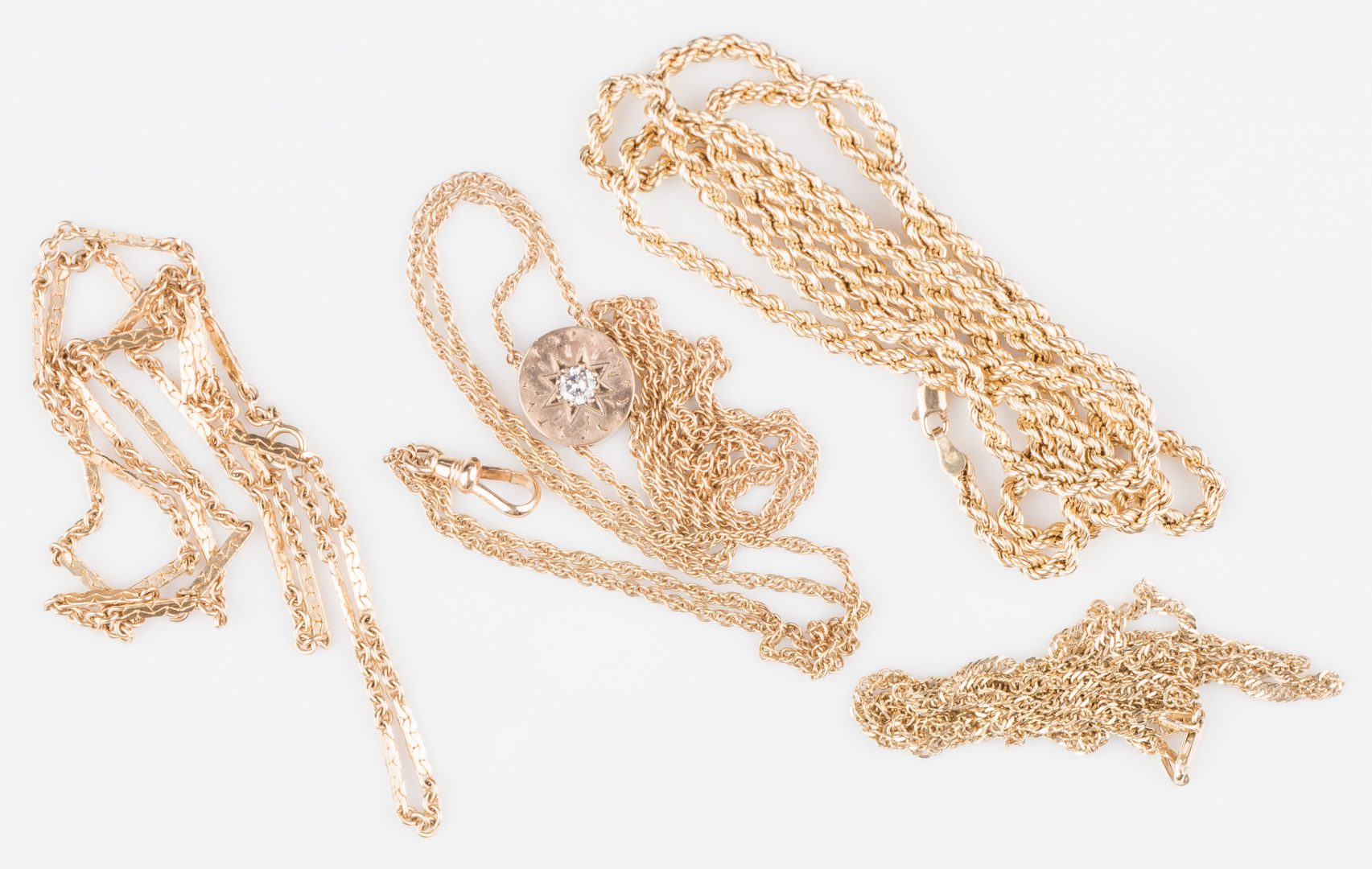 Lot 535: Four 14K Chains inc. watch chain