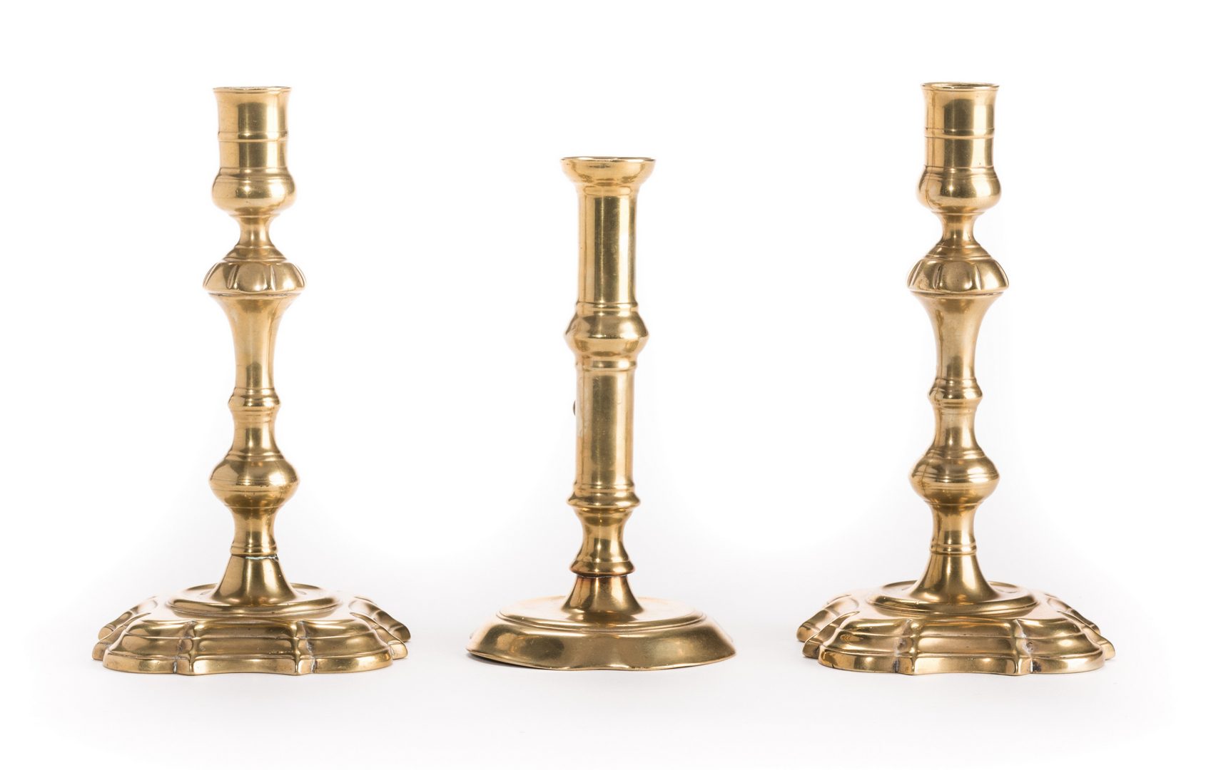 Lot 629: Group Early Brass Candlesticks, 3 items