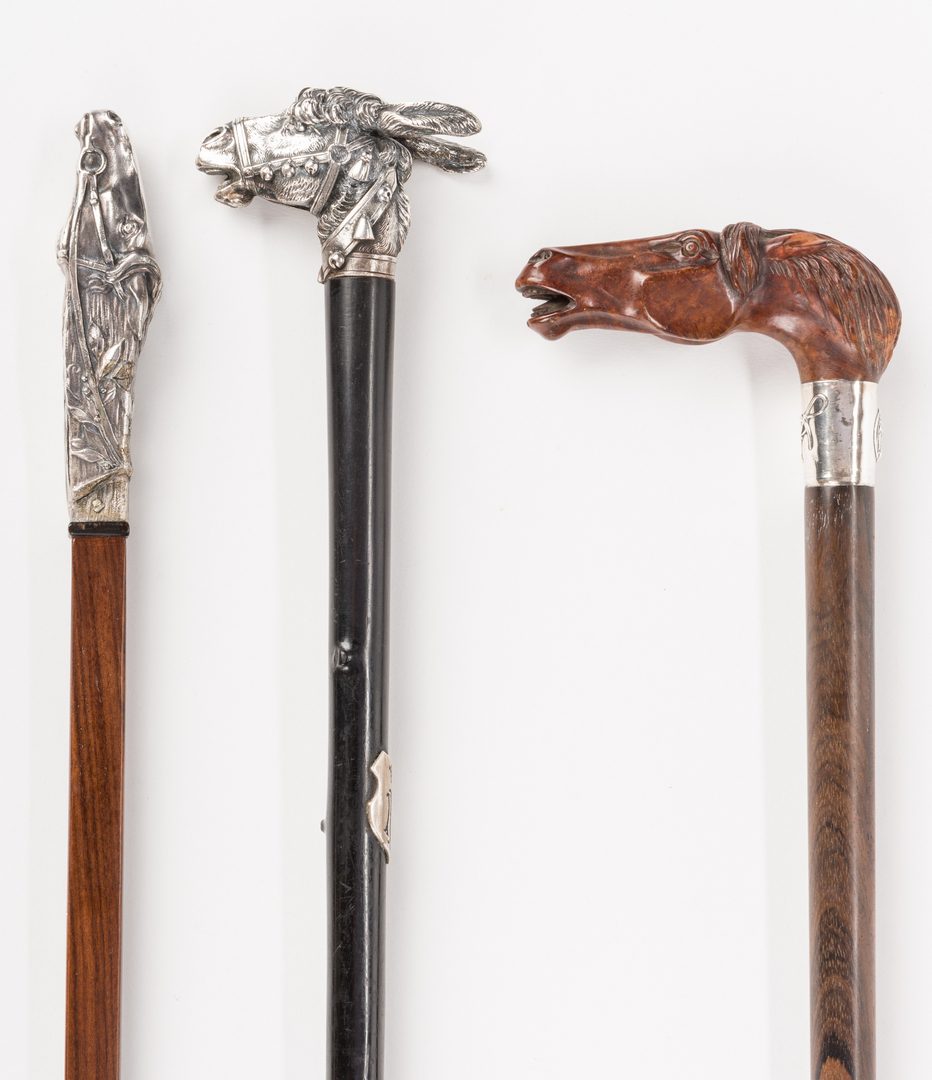 Lot 715: 3 Equine related walking sticks
