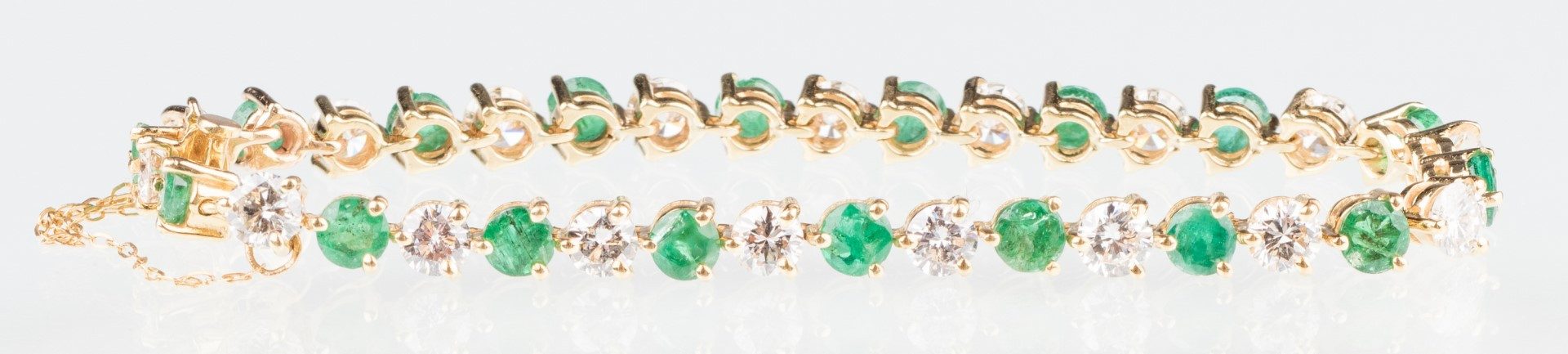 Lot 206: 18K Emerald & Diamond Line Bracelet
