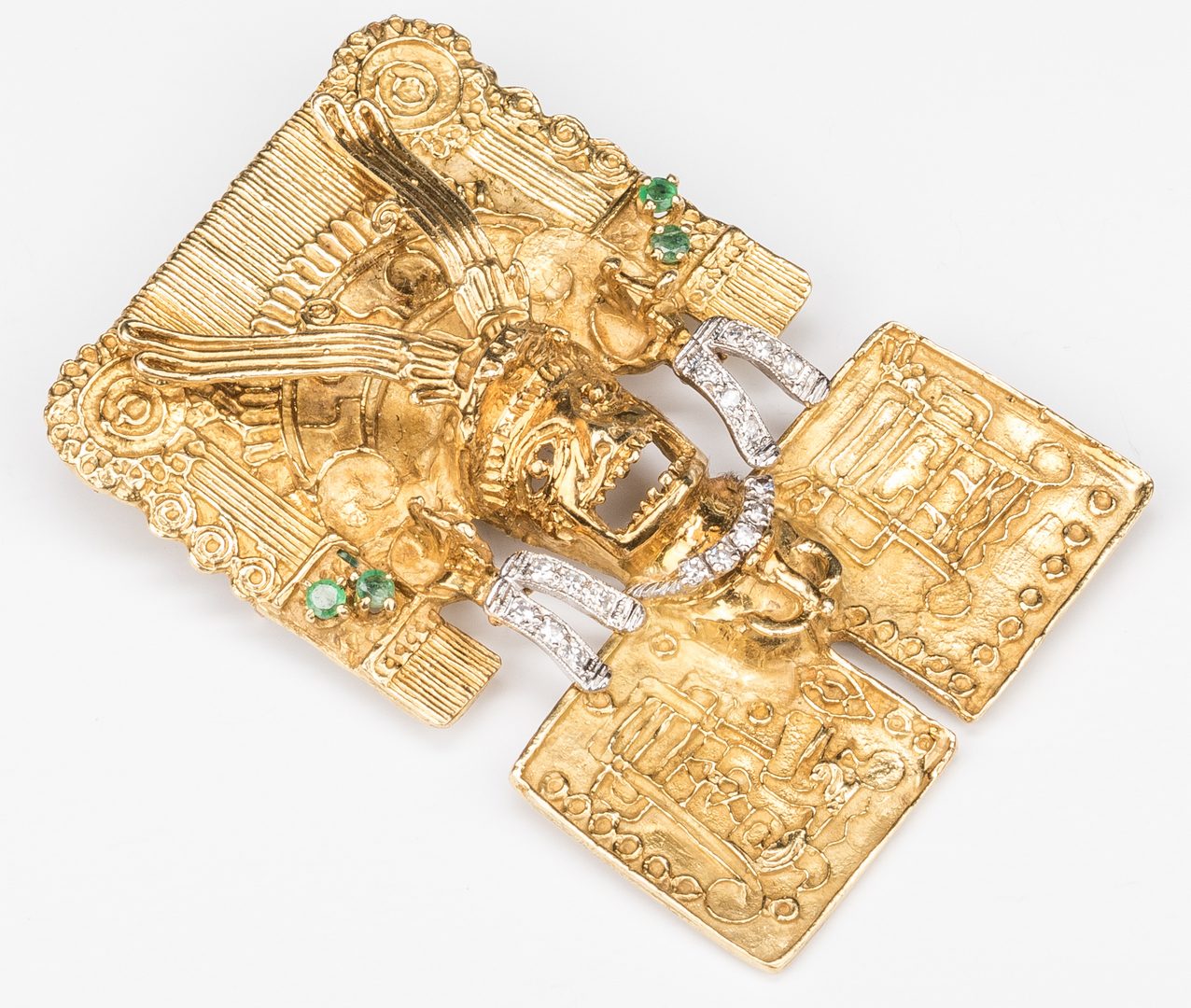 Lot 58: 18K Jeweled Aztec Pin/Enhancer, 49.8 grams