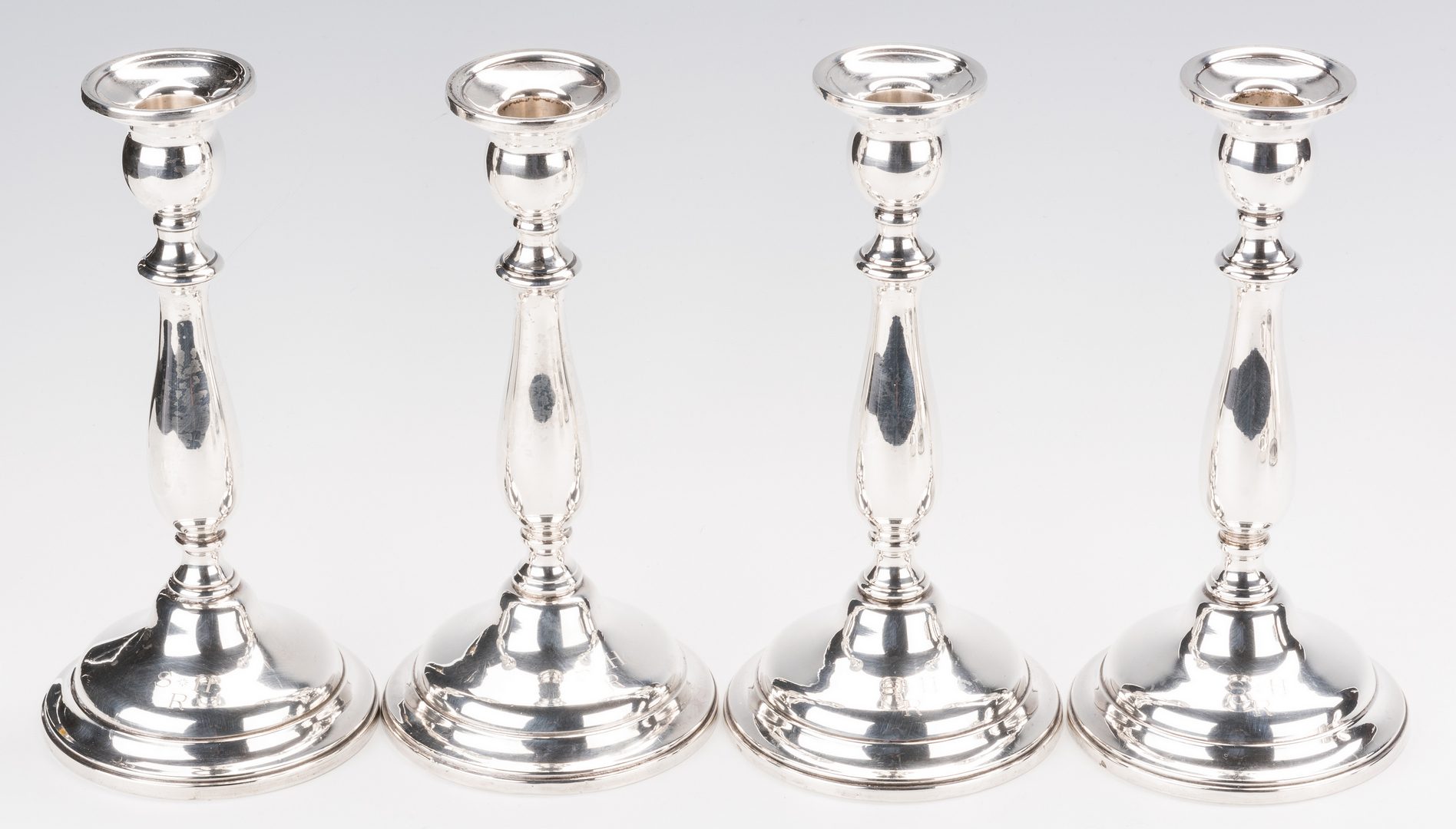 Lot 700: 12 silver items inc. 4 Lord Saybrook sterling candlesticks