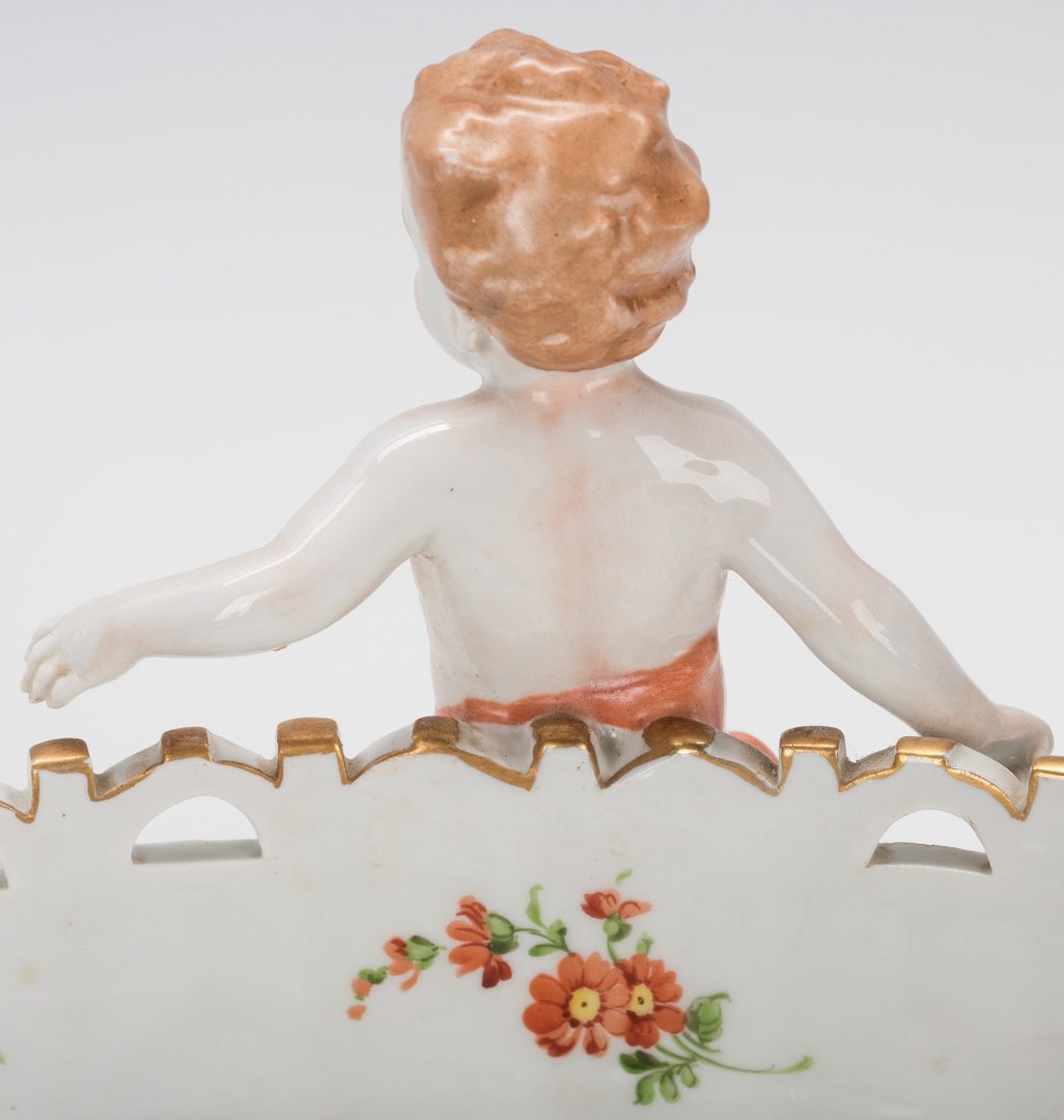 Lot 749: German Porcelain Figural Putti Jardiniere