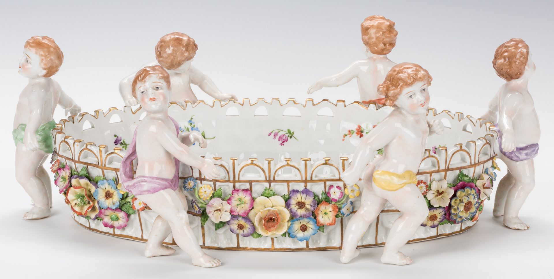Lot 749: German Porcelain Figural Putti Jardiniere