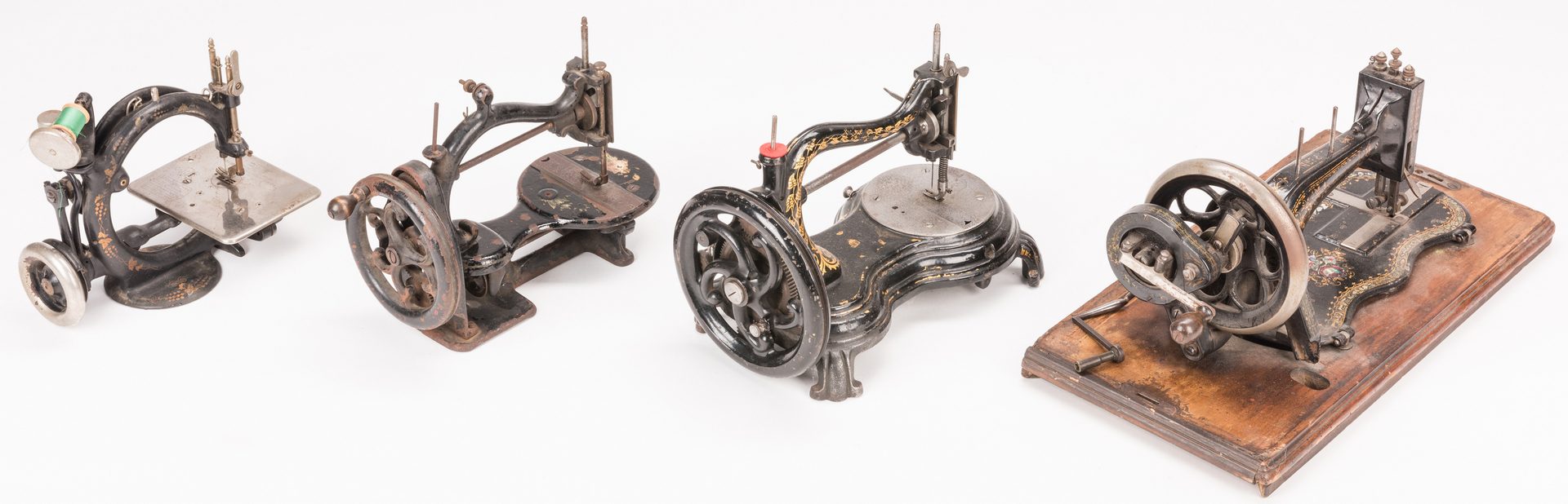 Lot 843: Four 19th c. Cast Iron Sewing Machines