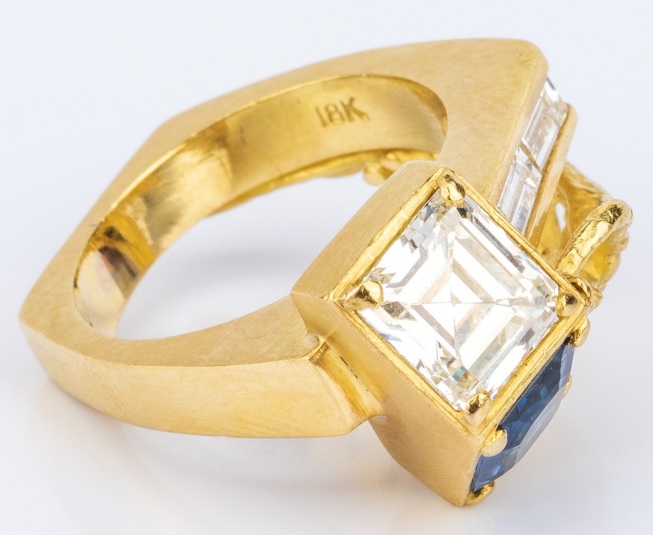 Lot 32: 18K Custom Diamond and Sapphire Ring