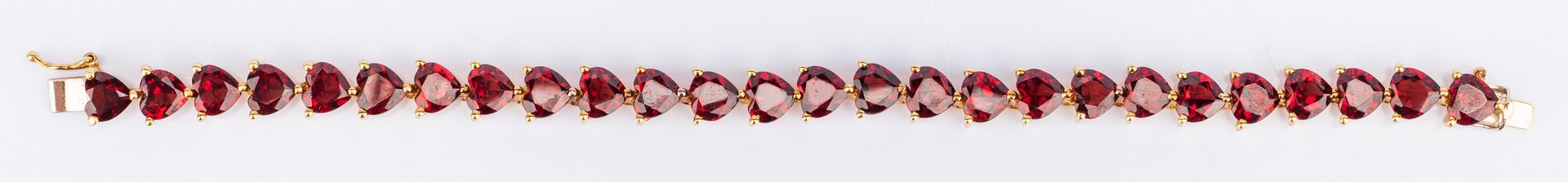 Lot 391: 18K Garnet Bracelet, marked Cartier