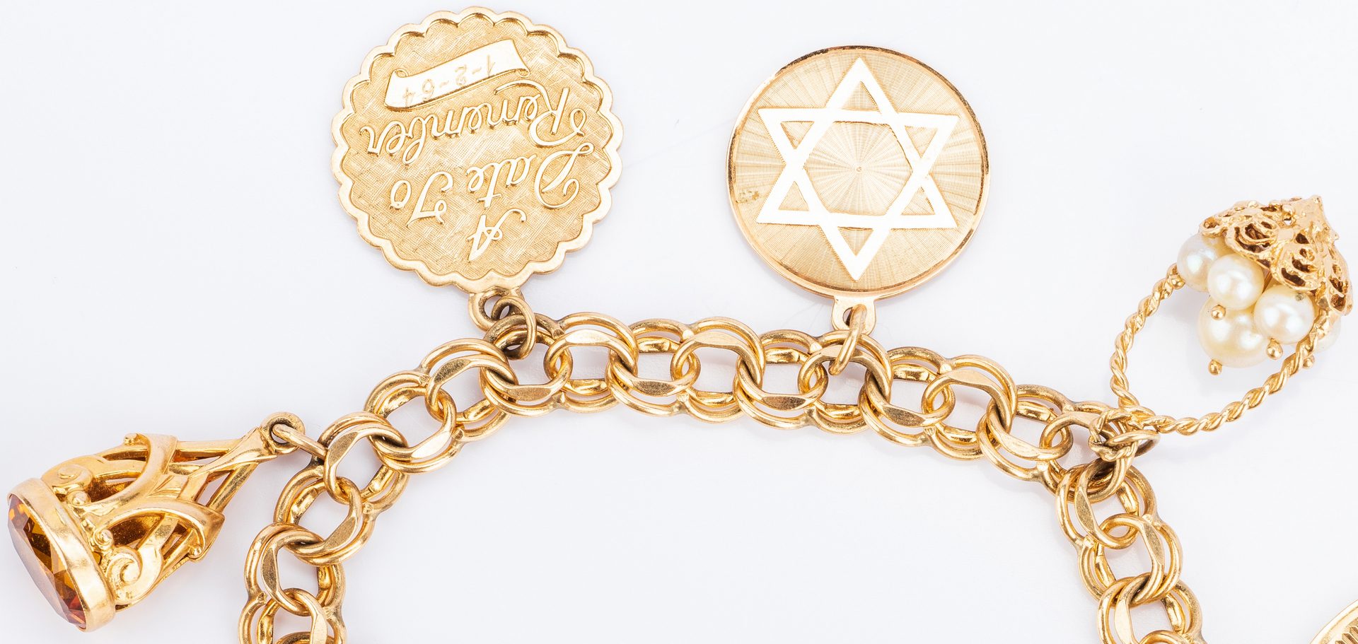 Lot 392: 14K Charm Bracelet, Judaica themes