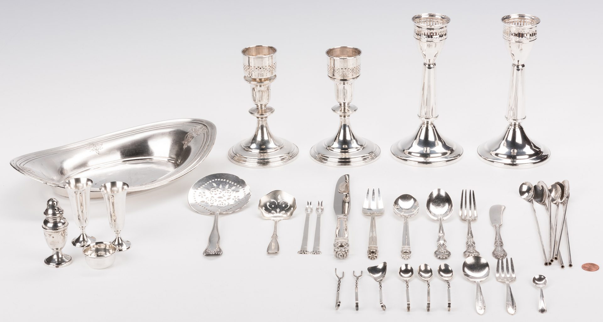Lot 874: 35 pcs assd. sterling table items and flatware incl. candlesticks