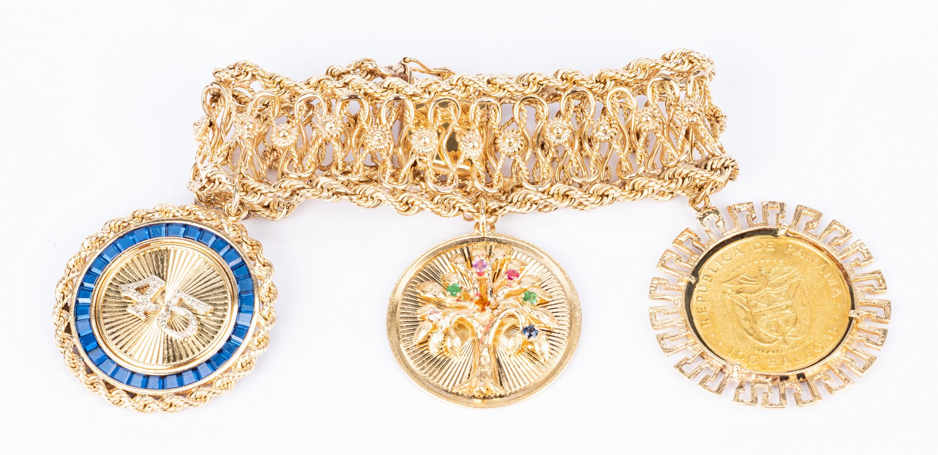 Sold at Auction: 14K YELLOW GOLD CHARM BRACELET W/ CHARMS, 73.7 GRAMS