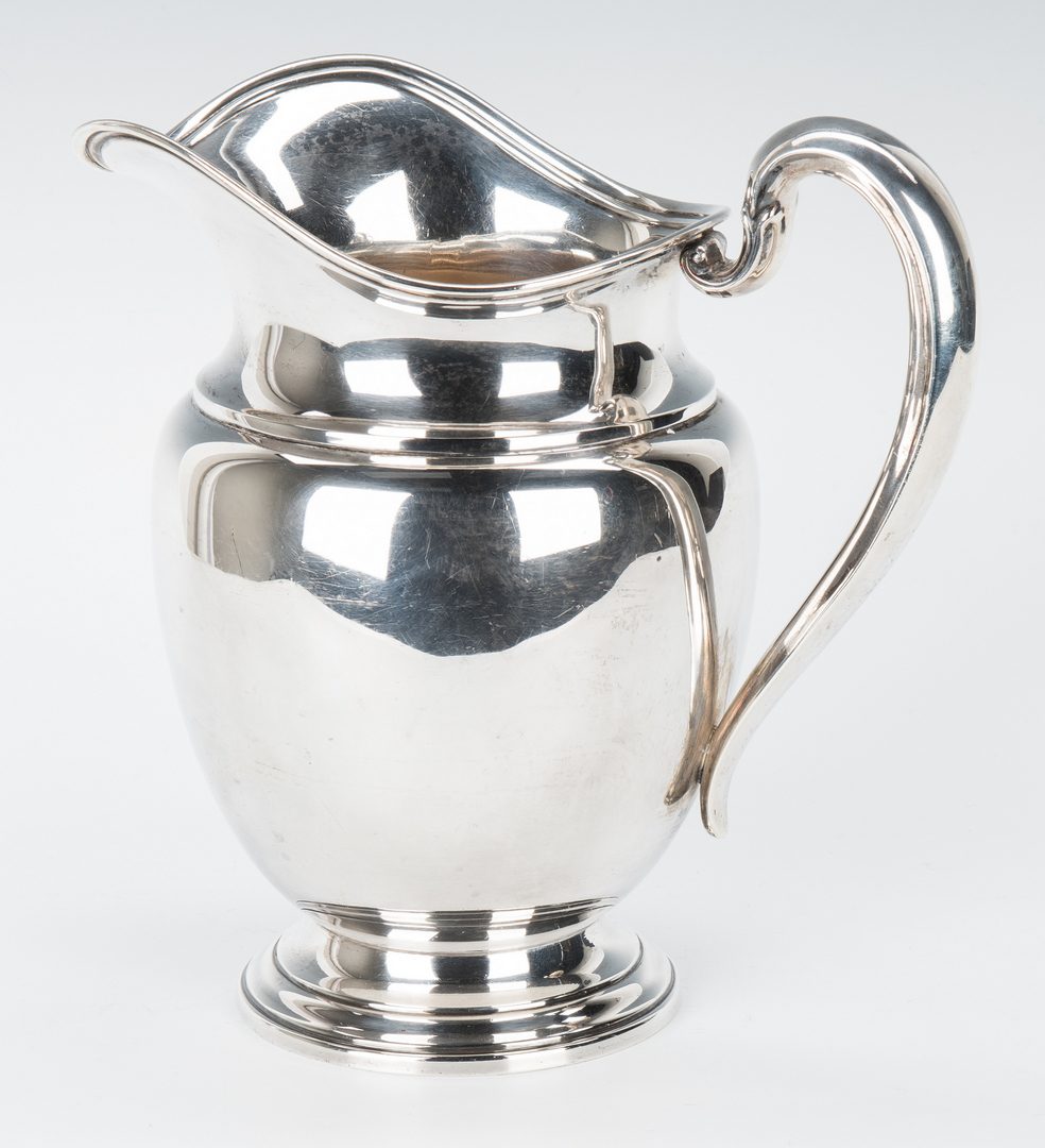 Lot 715: Sterling Silver Pitcher and Bread Plates, 9 items