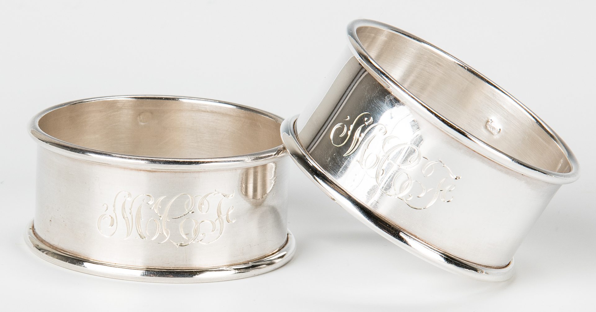Lot 854: Assembled Group 31 Napkin Rings, most Sterling