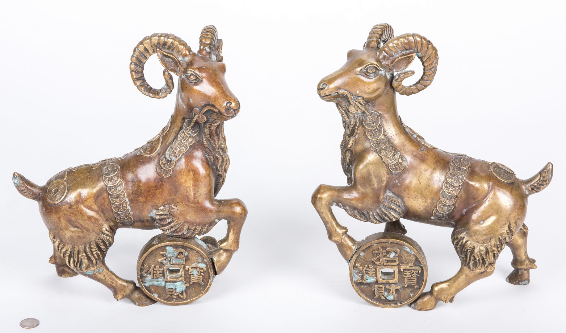 Lot 402: Pair Chinese Ram figures, Ming style