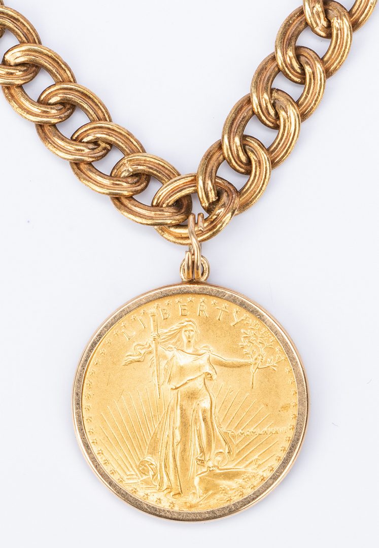 Lot 178: 14K gold chain with 4 charms incl. coin