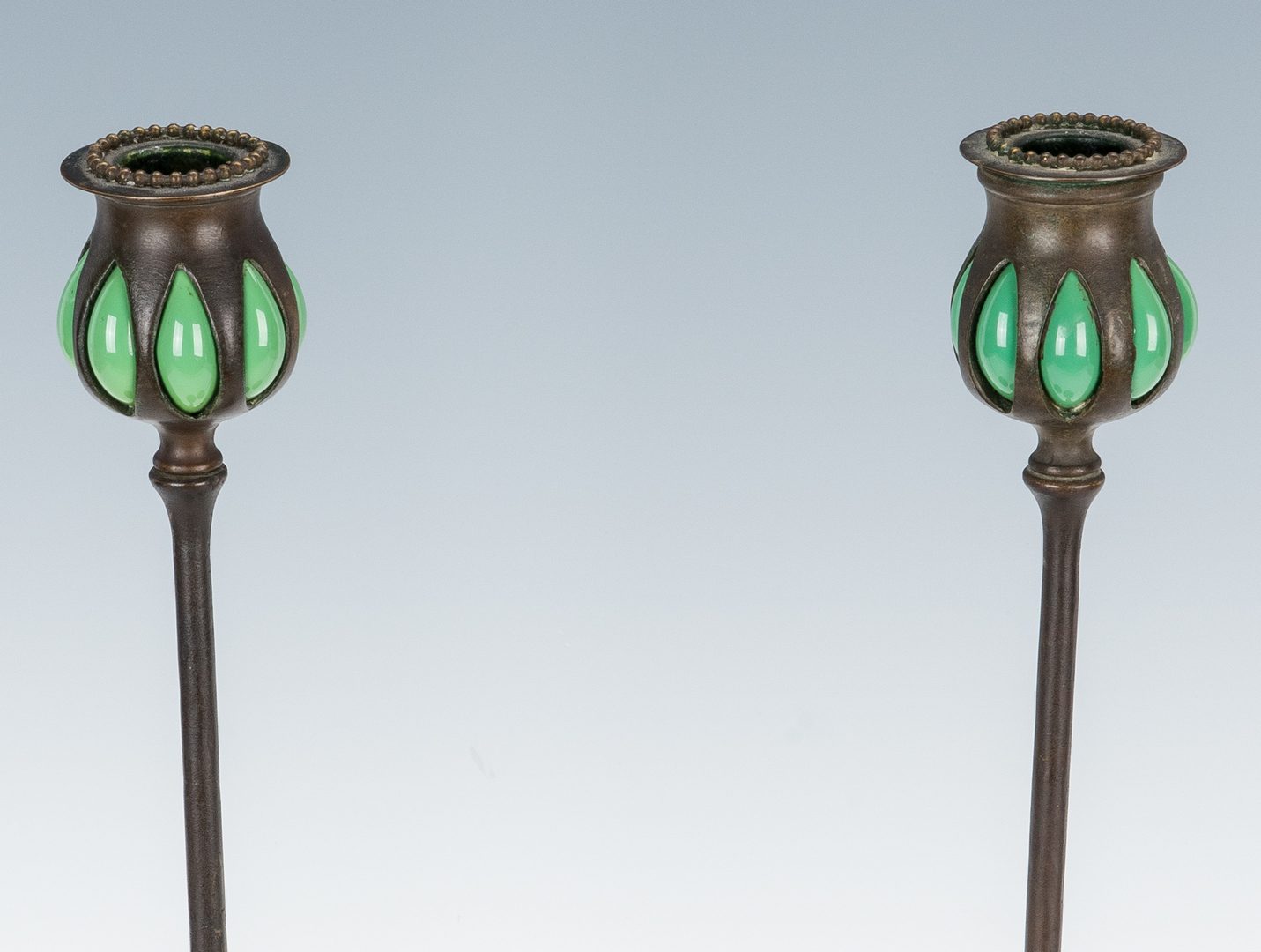 Lot 508: Pair of Tiffany Studios Bronze & Glass "Puddle" Candlesticks