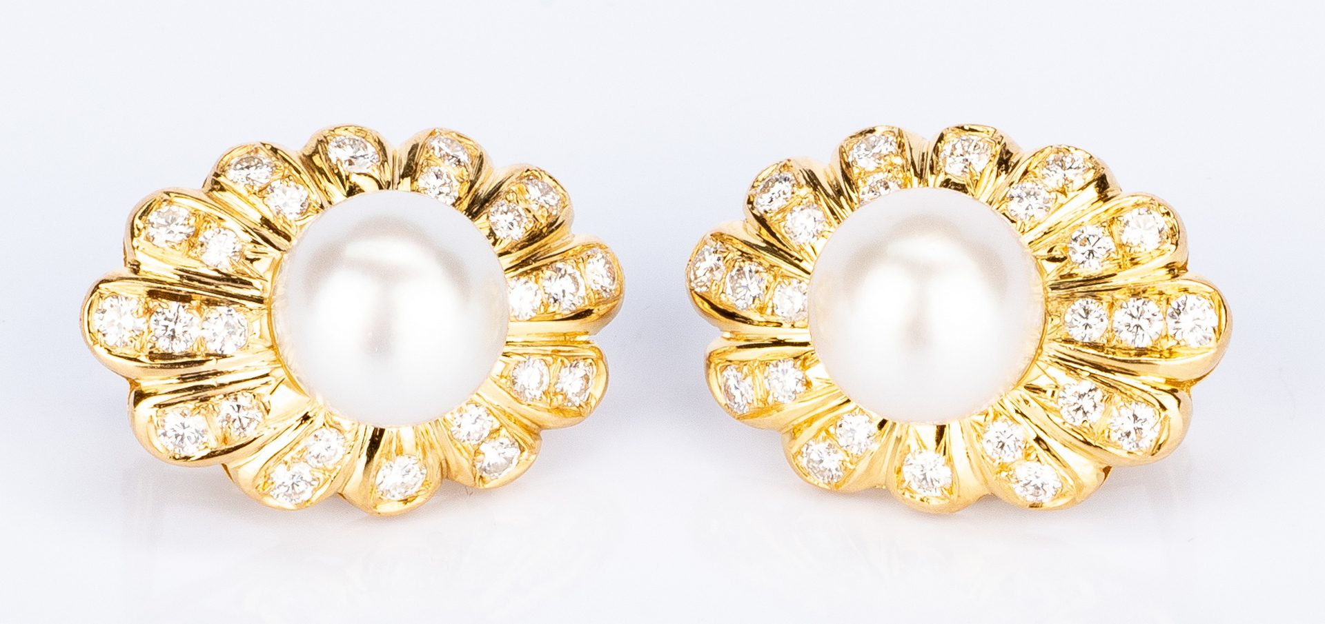 Lot 631: Pair of Trio 18K Pearl Diamond Shell Earrings