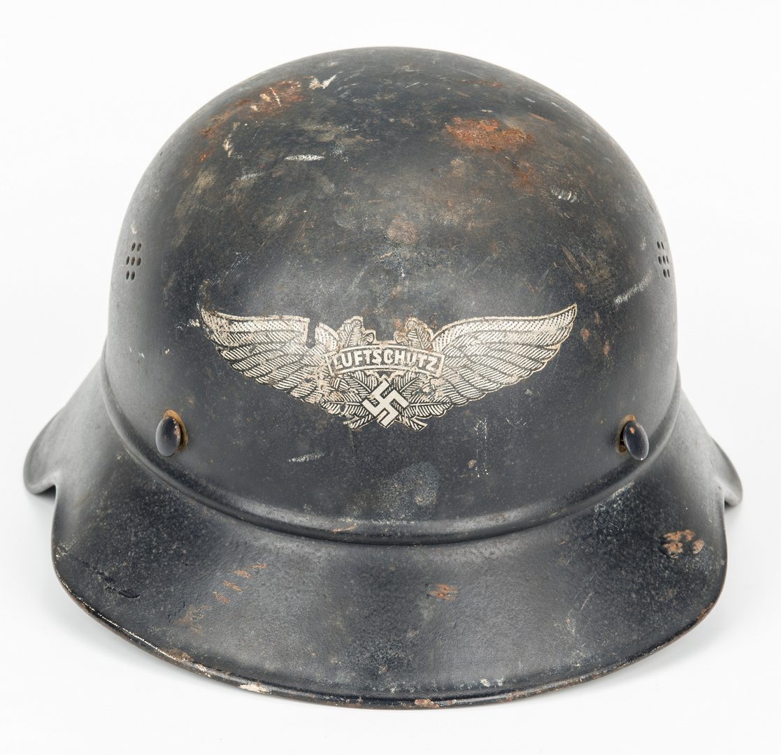 Lot 725: WWII German Helmet & WWI Booklet, 2 items