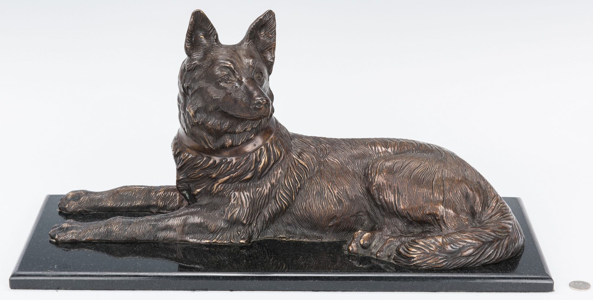 Lot 151: Large Bronze Sculpture of Recumbent Dog after Chiparus