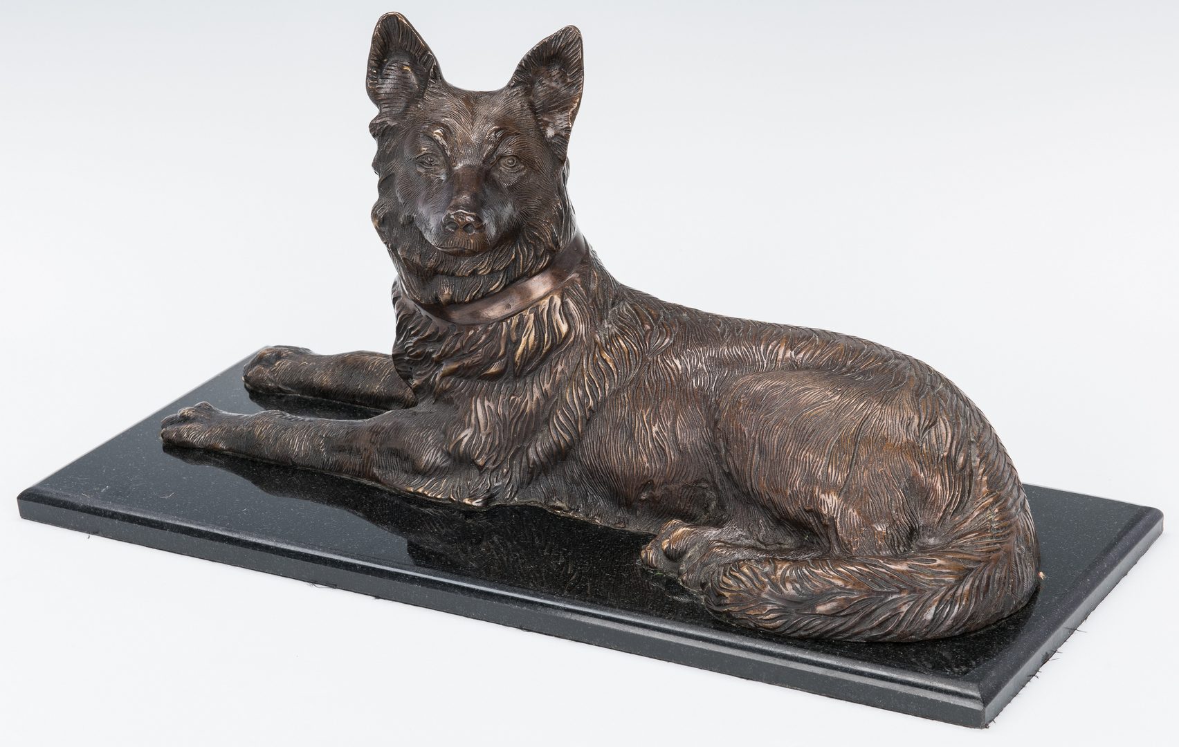 Lot 151: Large Bronze Sculpture of Recumbent Dog after Chiparus