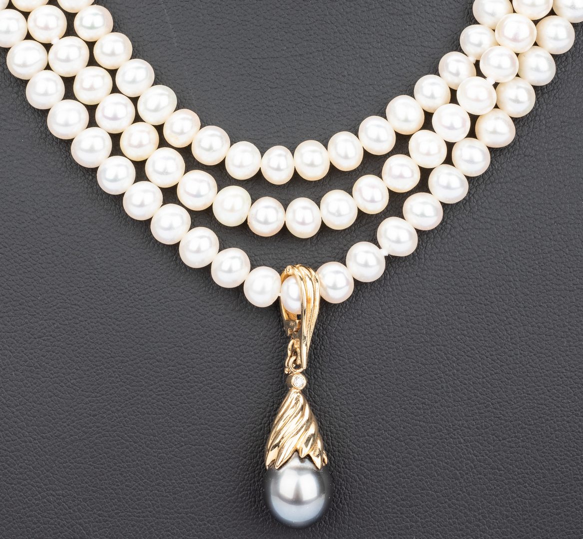 Lot 55: Three Strand Pearl Necklace and Enhancer