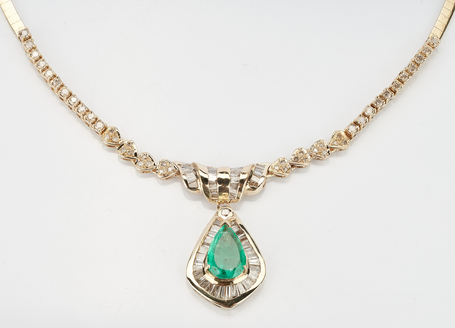 Lot 219: 14K 3.5 Carat Emerald and Diamond Necklace