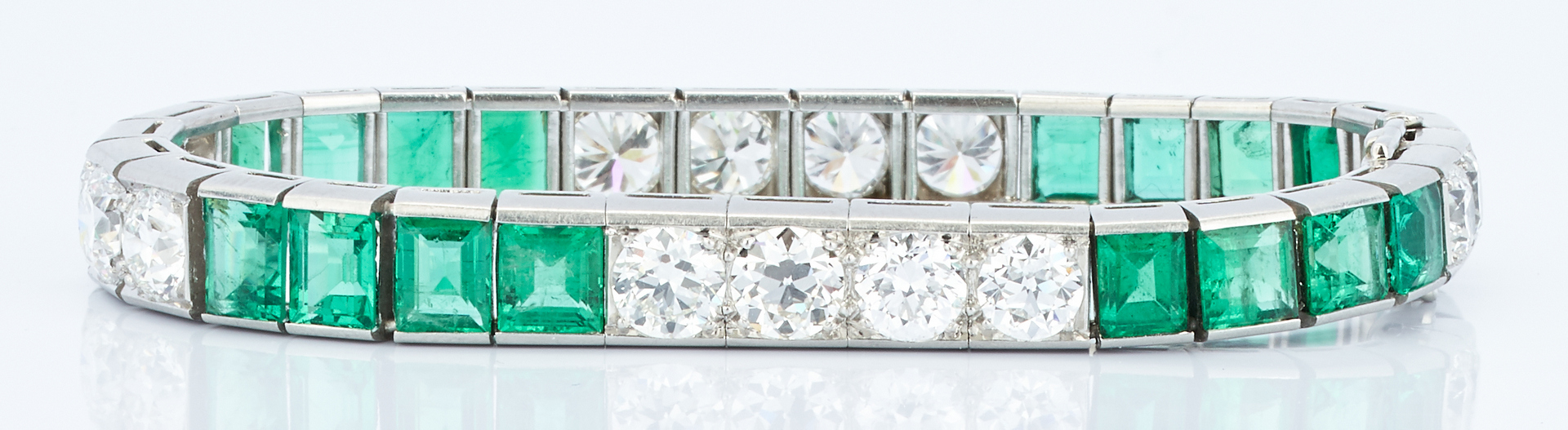 Lot 31: Ladies Platinum Diamond and Emerald Bracelet