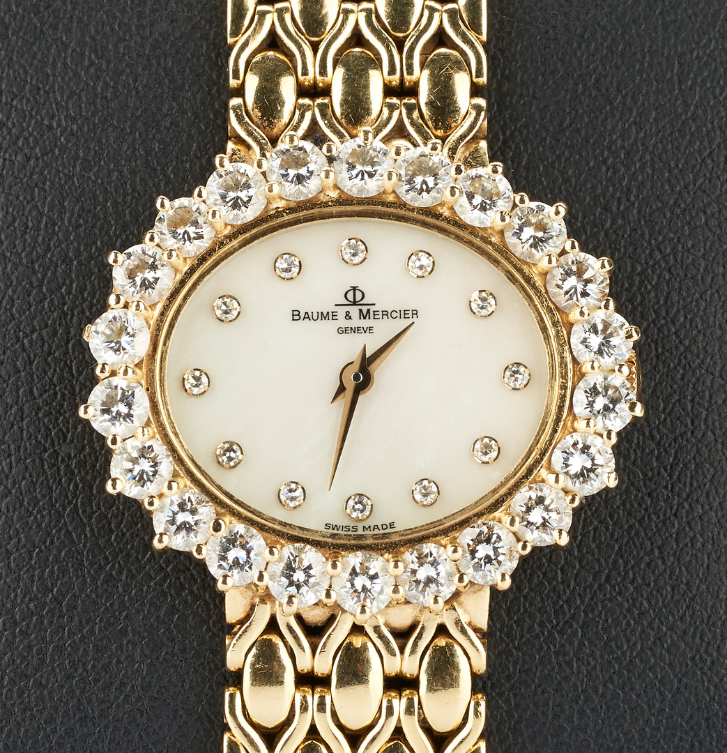 Lot 40: 18K Baume & Mercier watch with Diamond Surround