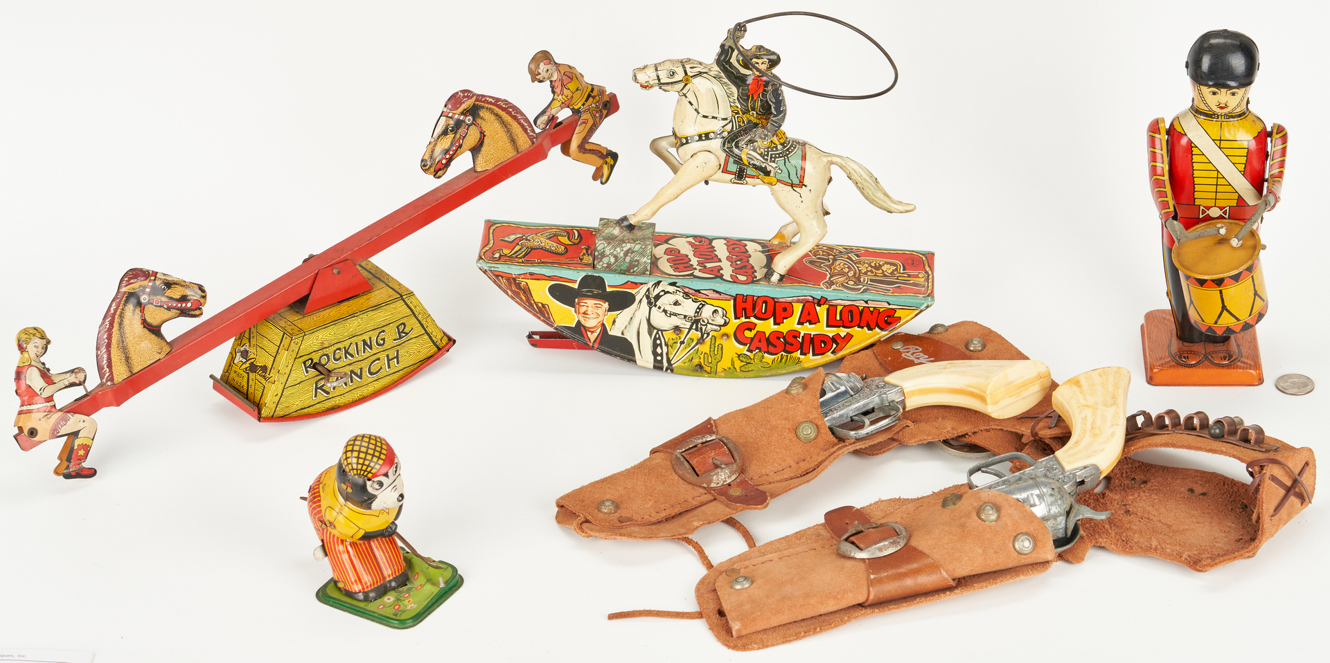 Lot 985: 4 Tin Litho Toys plus 2 Pony Boy Guns, Roy Rogers Holster