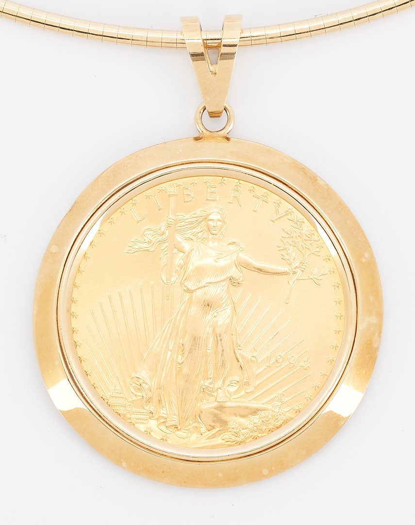 Lot 259: 14K Gold Necklace & Bezel w/ American Eagle Coin