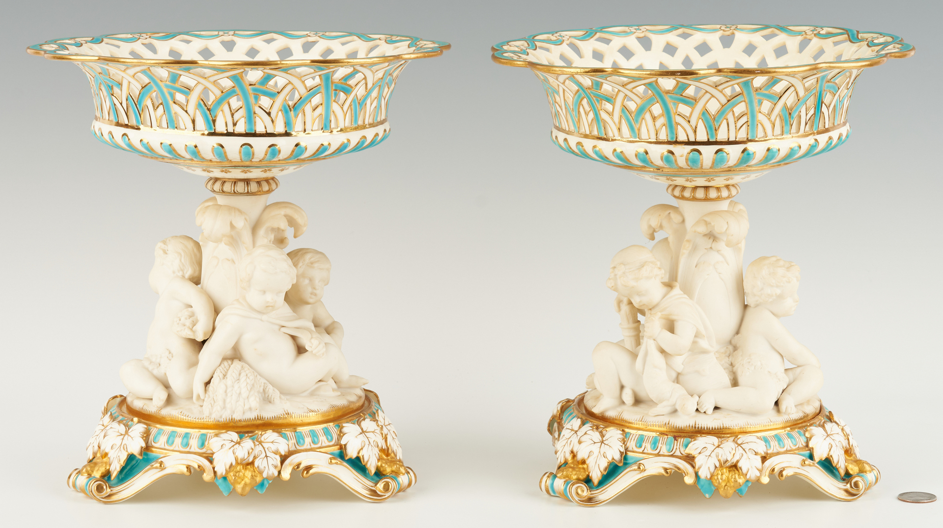 Lot 310: Pair Porcelain Corbeilles with Bisque Putti