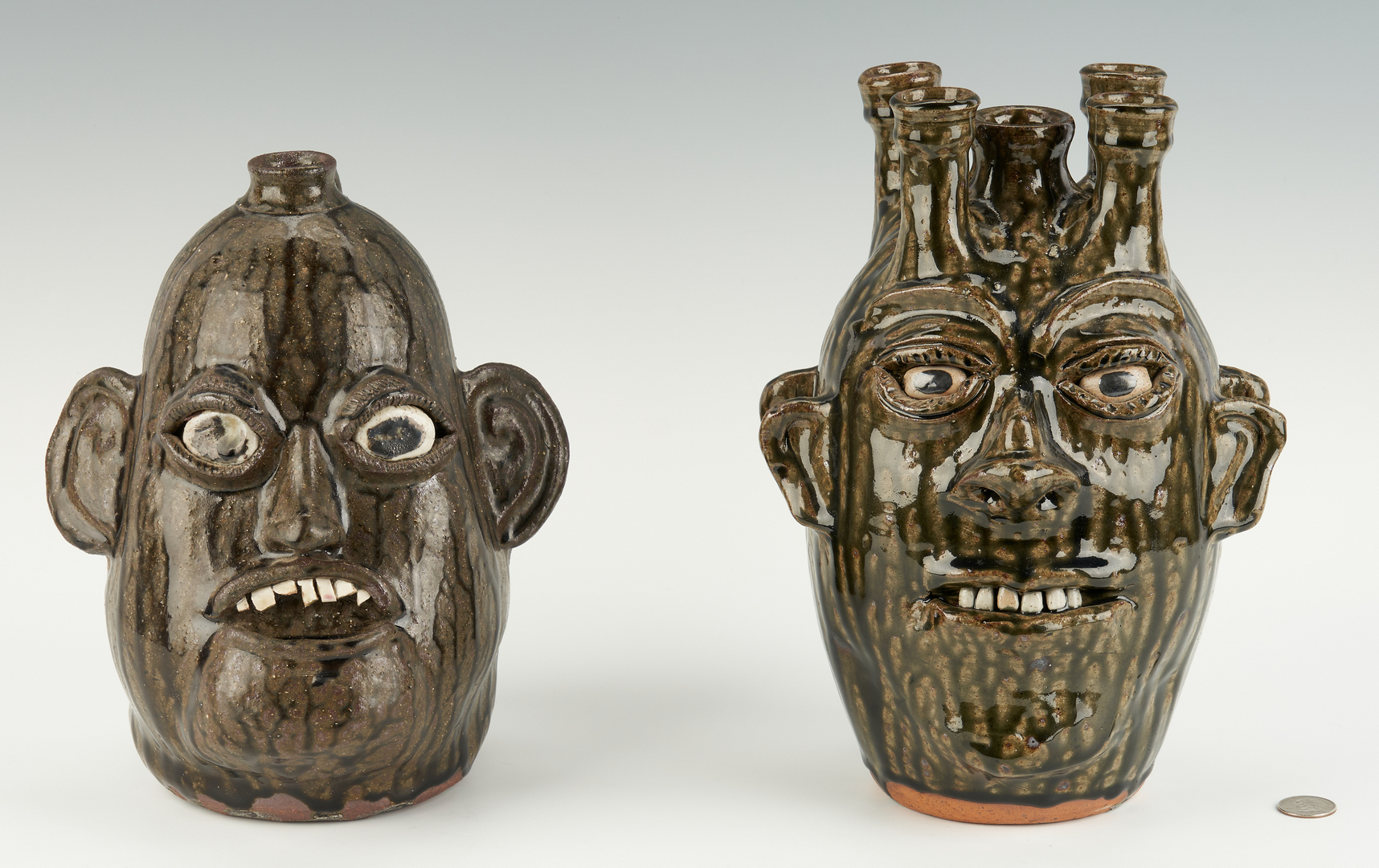 Lot 468: 2 GA Stoneware Pottery Face Jugs, incl. C. & B. Meaders, M. Hewell