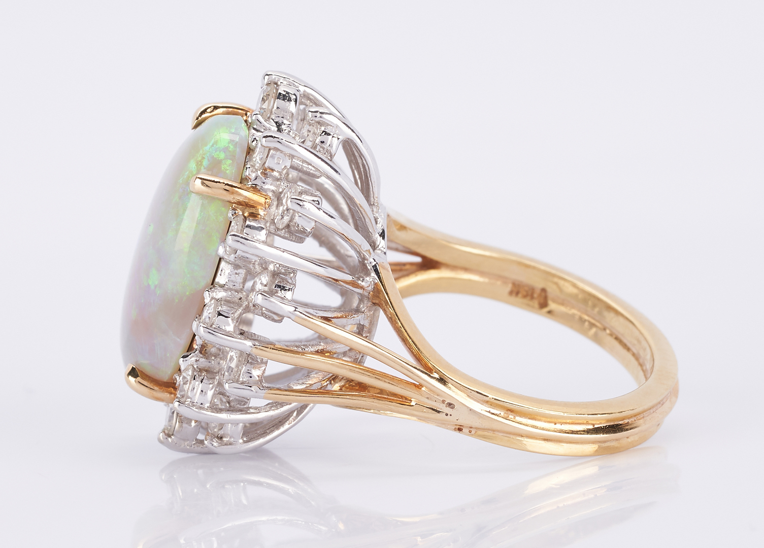 Lot 510: 18K Opal and Diamond Ring + Earrings