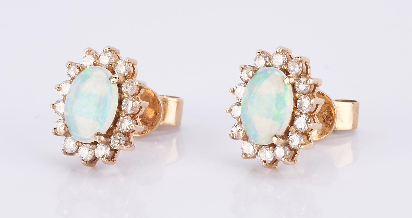 Lot 510: 18K Opal and Diamond Ring + Earrings