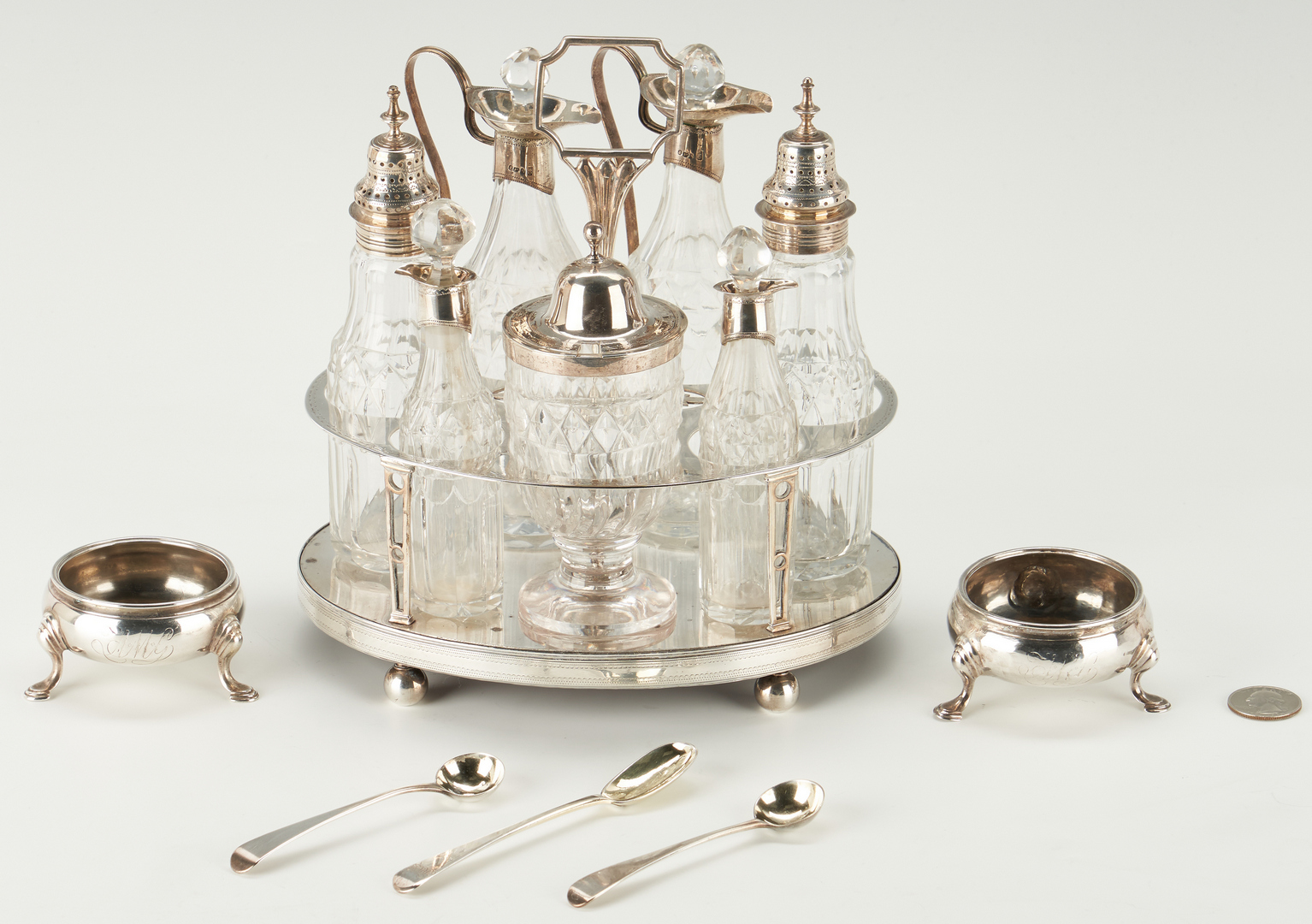 Lot 81: Geo. III Sterling Cruet Stand, Hennell Salts and spoons