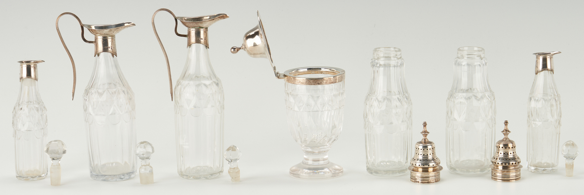 Lot 81: Geo. III Sterling Cruet Stand, Hennell Salts and spoons