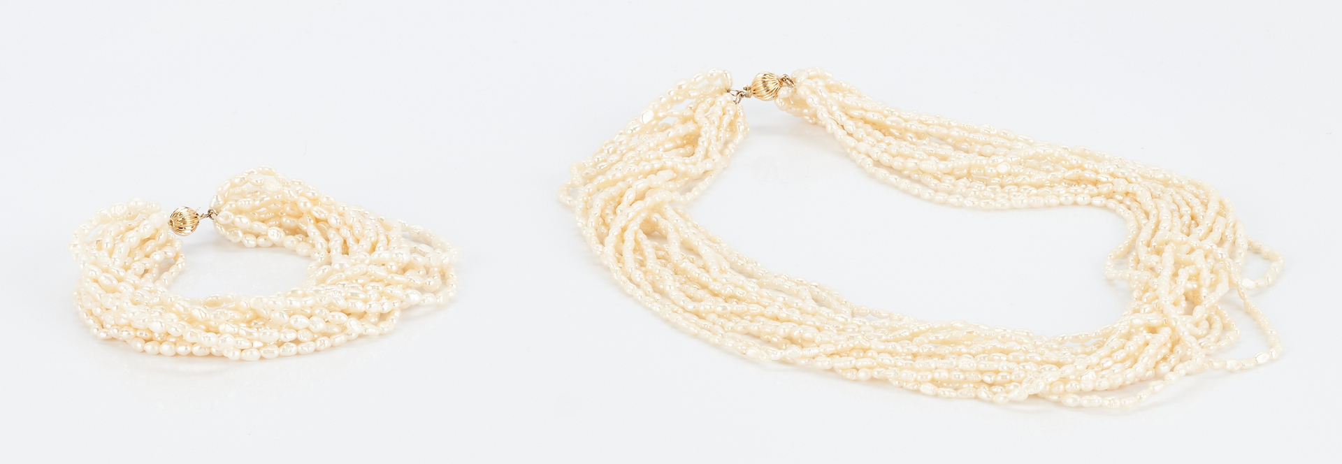 Lot 918: Multi Strand Pearl Necklace and Bracelet