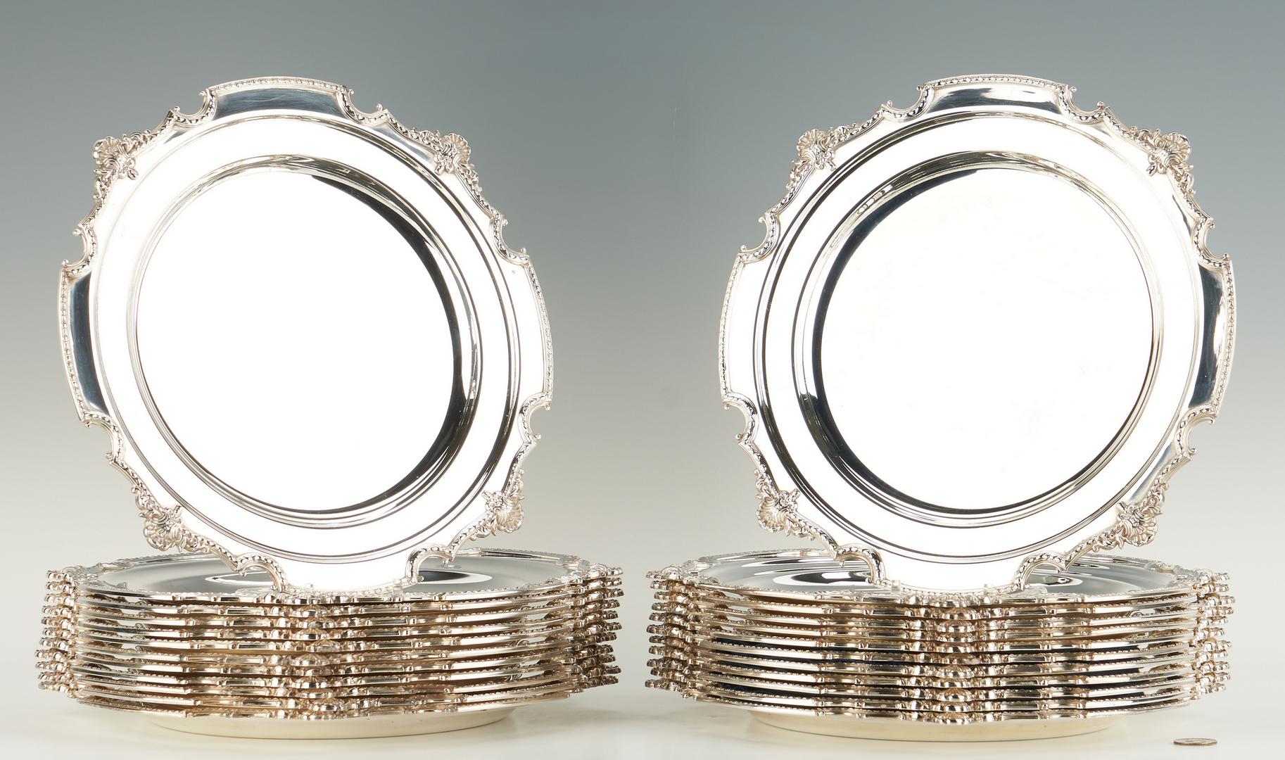 Lot 946: 24 Silverplated English Chargers