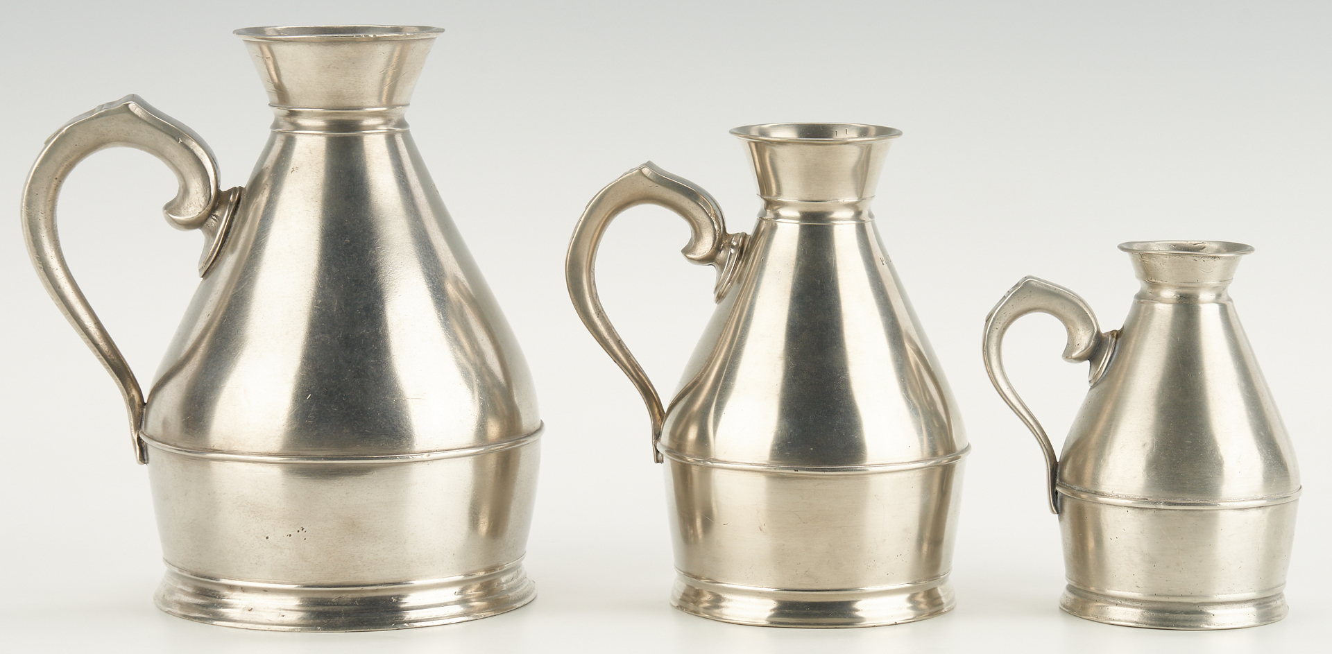 Lot 275: 11 Pcs. Pewter Flagons, Tankards, Jugs and Measures