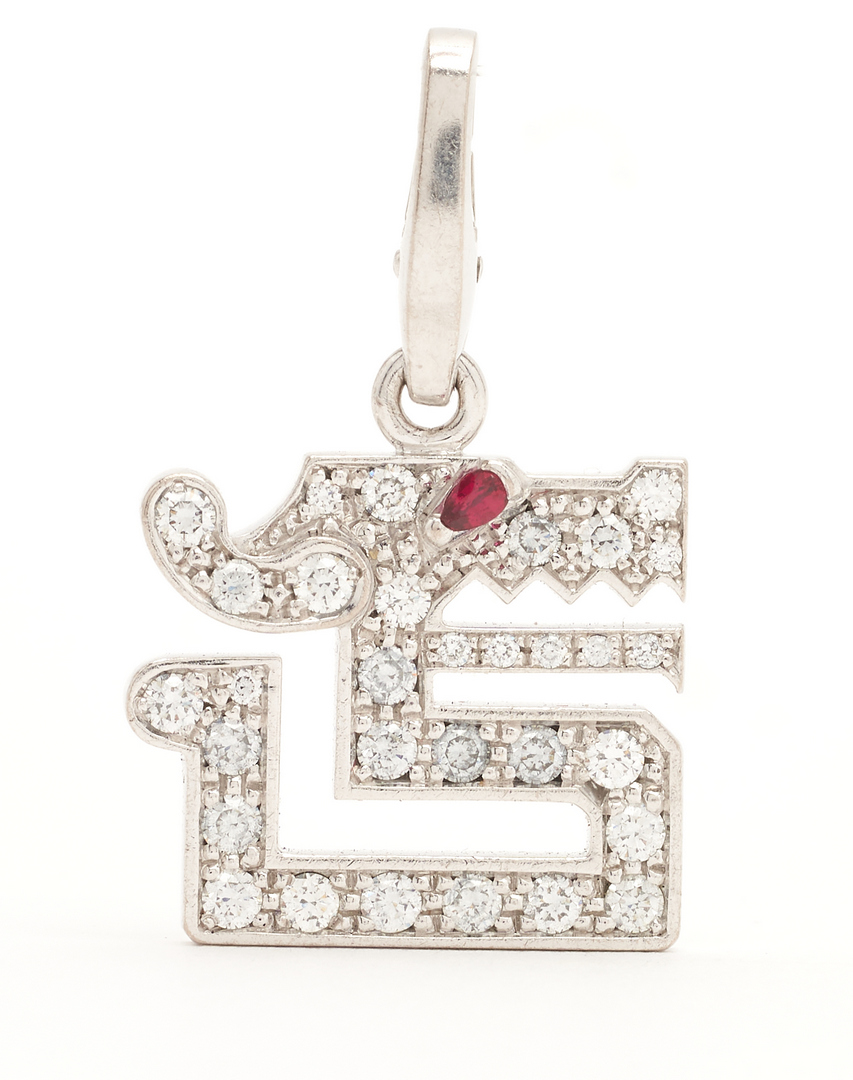 Lot 67: Cartier Diamond & Ruby Baiser Du Dragon 18K Pendant