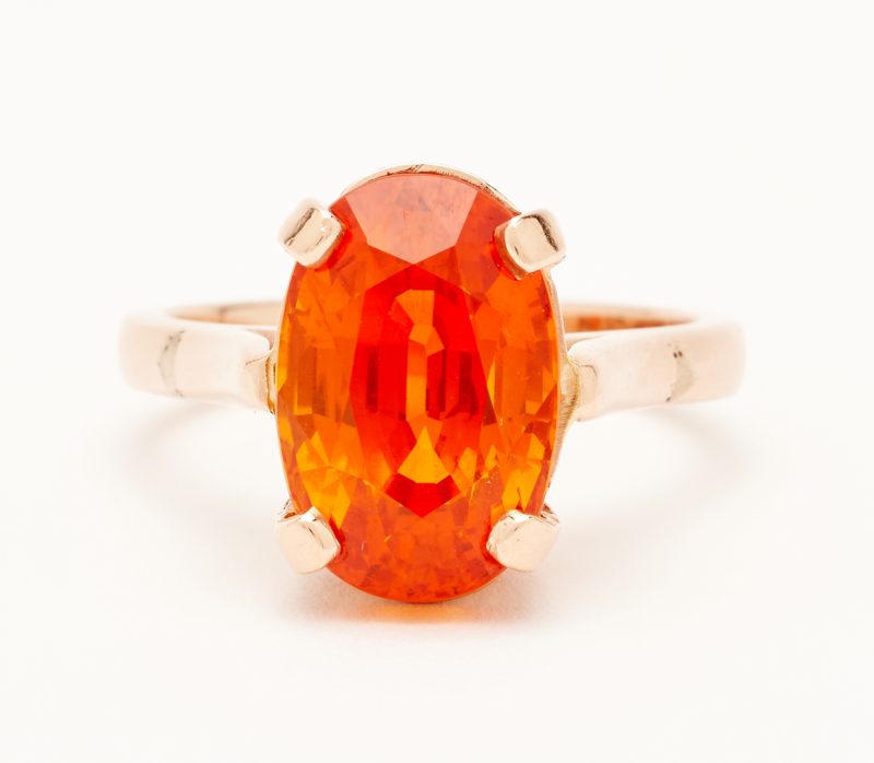 Lot 824: Ladies 14K Rose Gold & Orange Sapphire Ring
