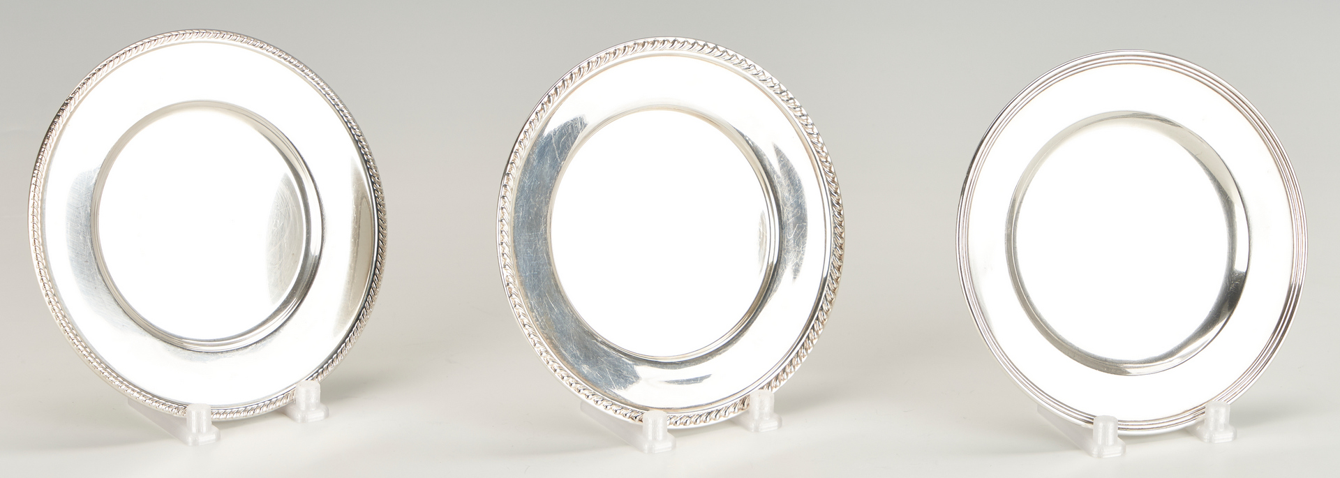 Lot 1227: 13 Sterling Silver Bread Plates, Fina and Amston