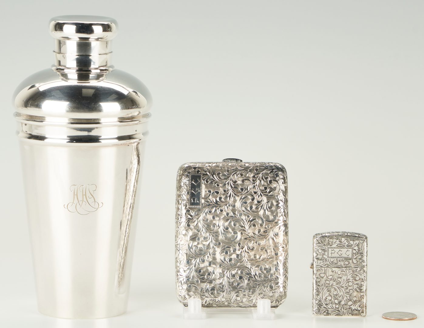 Lot 1253: Tiffany & Co. Silver Cocktail Shaker + Sterling Cigarette Case & Lighter, 3 items