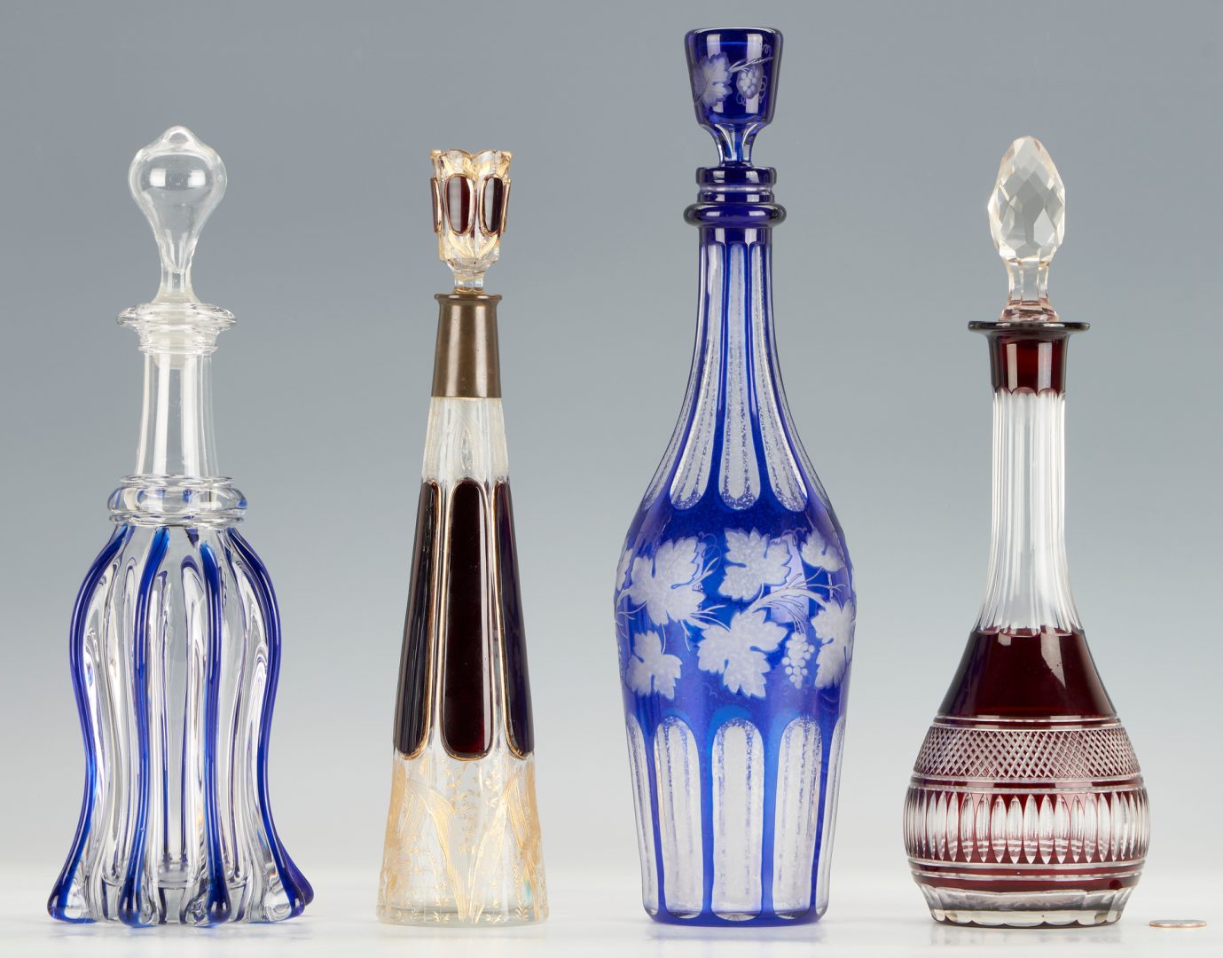 Lot 210: 4 Crystal Decanters, incl. Cobalt & Cranberry Cut to Clear