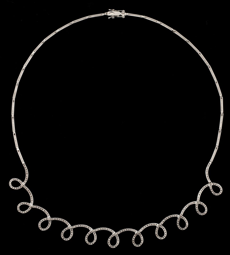 Lot 216: Ladies 18K Gold & Diamond Loop Necklace