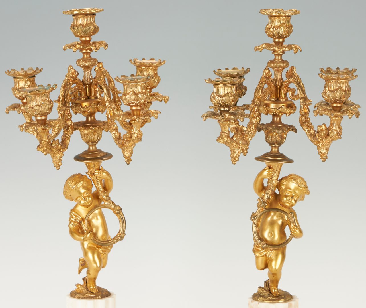 Lot 74: Pair of Neoclassical Gilt Bronze Cherub Form Candelabras
