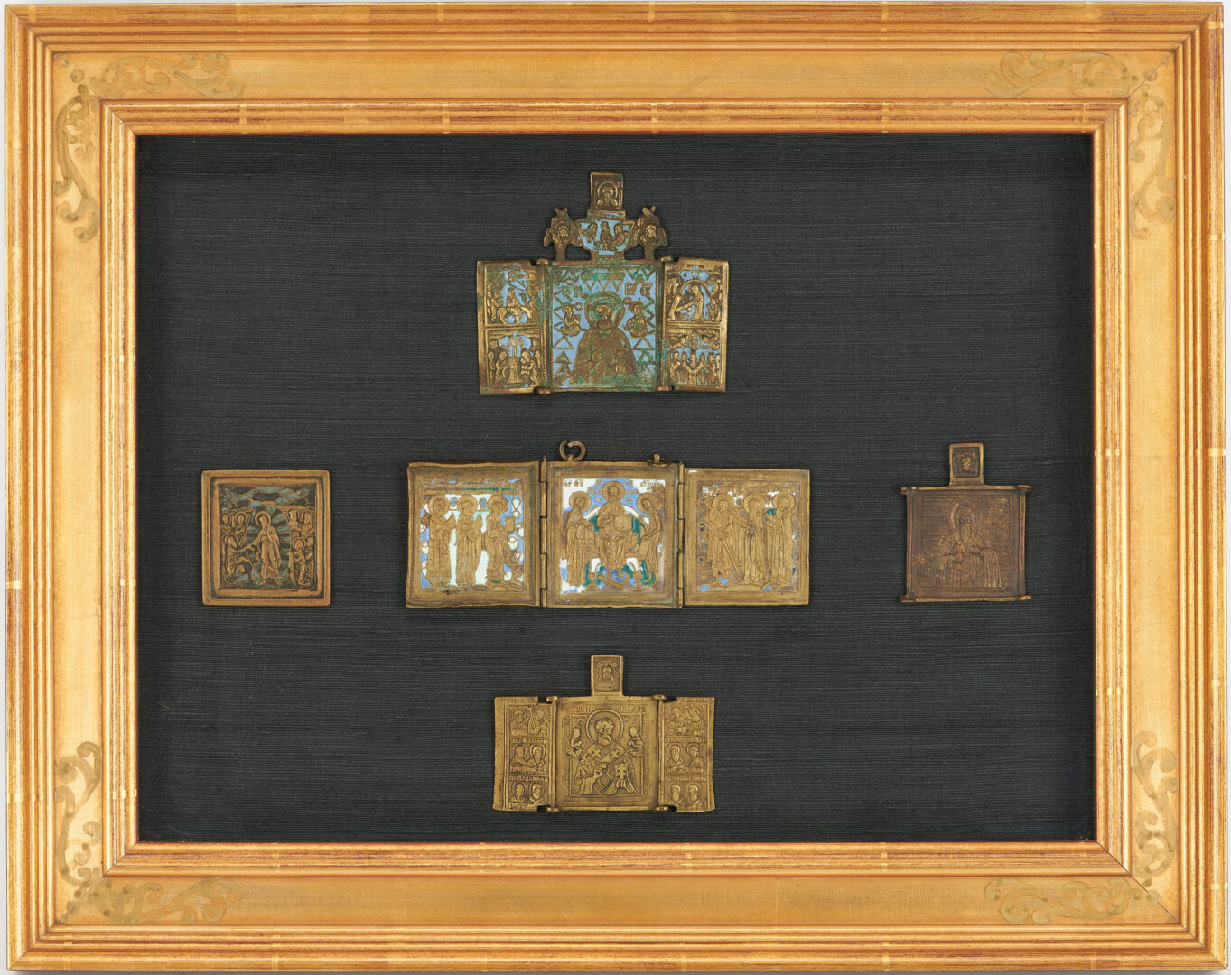 Lot 386: 12 Brass Russian Traveling Icons in 2 Framed Groupings