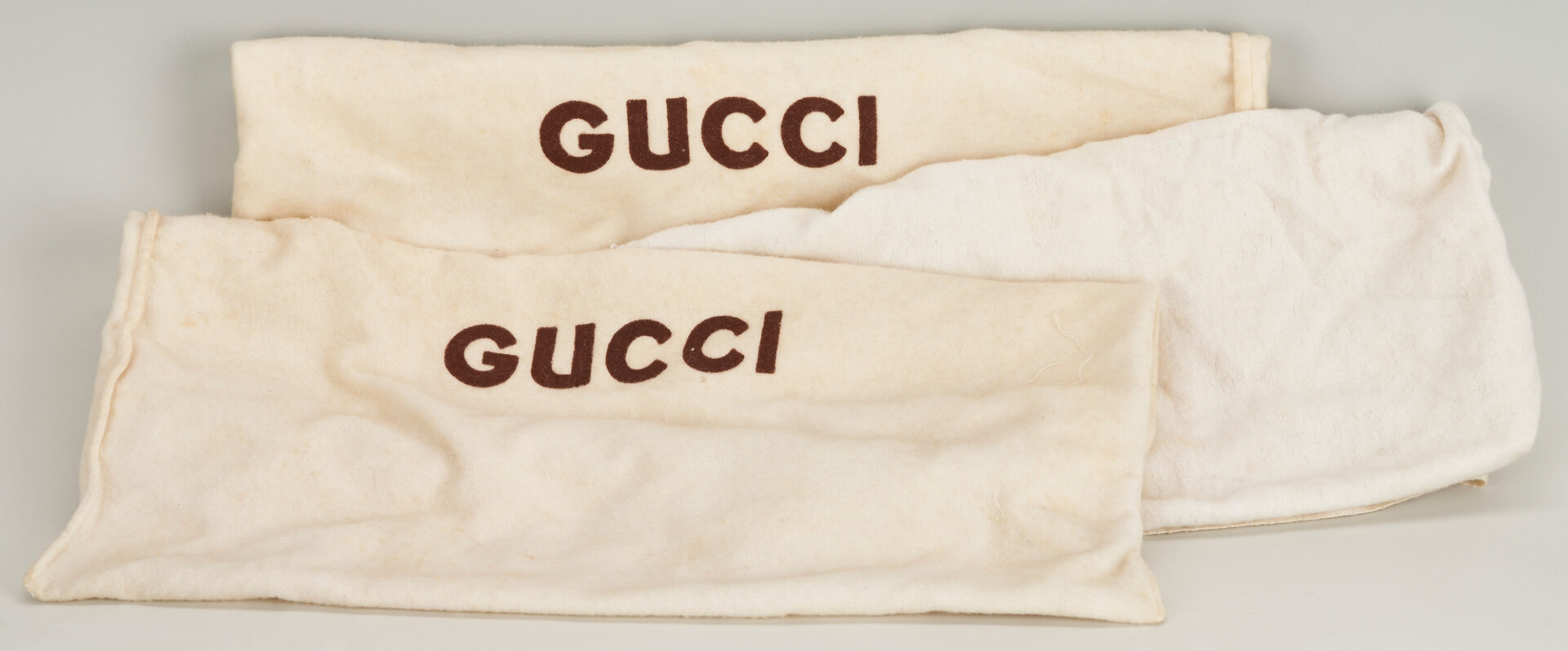 Lot 747: 3 Gucci Items, incl. 2 Top Handle Bags, 1 Hanging Toiletry Bag